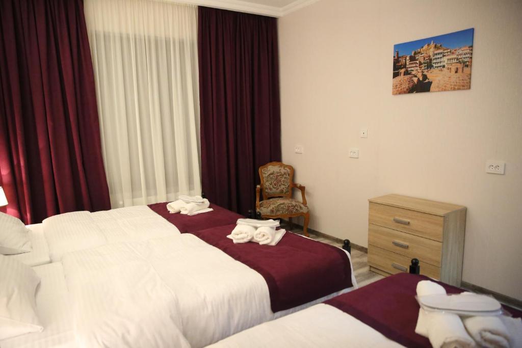 Postel nebo postele na pokoji v ubytování X Palace