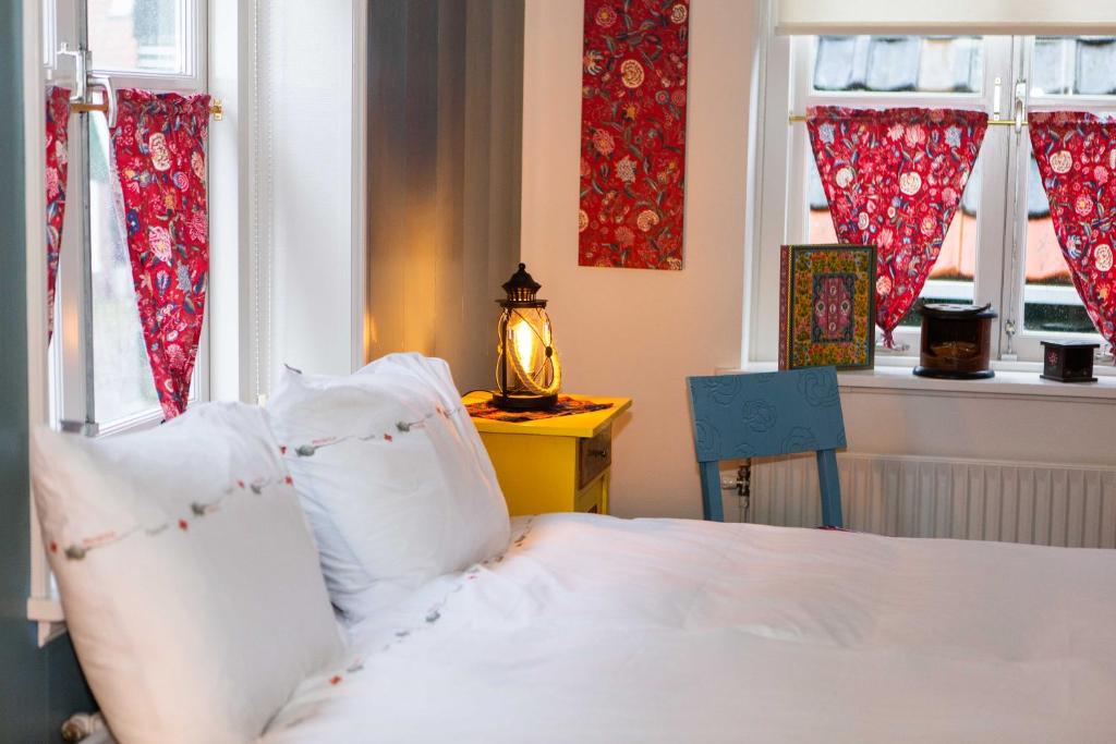 Postel nebo postele na pokoji v ubytování Bed and Breakfast De Pepersteeg