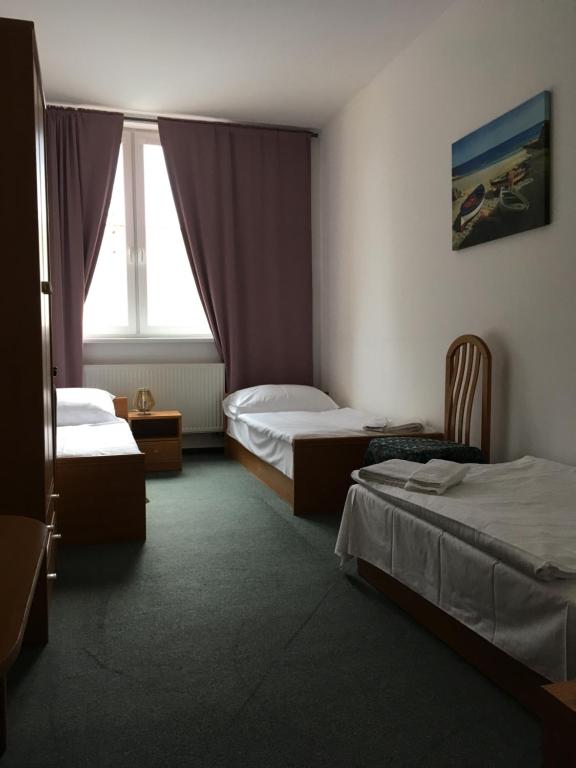 Postel nebo postele na pokoji v ubytování Hotel Arko