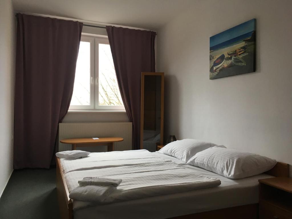 Postel nebo postele na pokoji v ubytování Hotel Arko