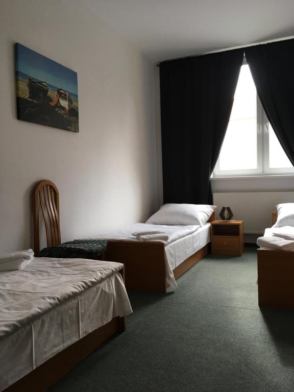 Postel nebo postele na pokoji v ubytování Hotel Arko