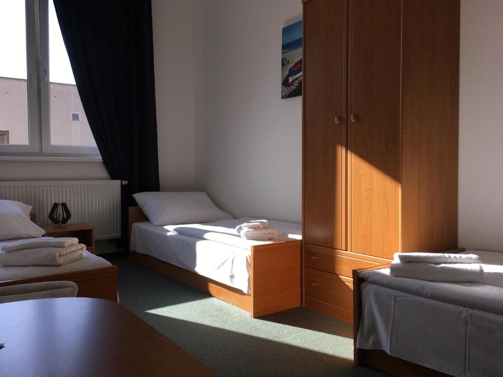 Postel nebo postele na pokoji v ubytování Hotel Arko