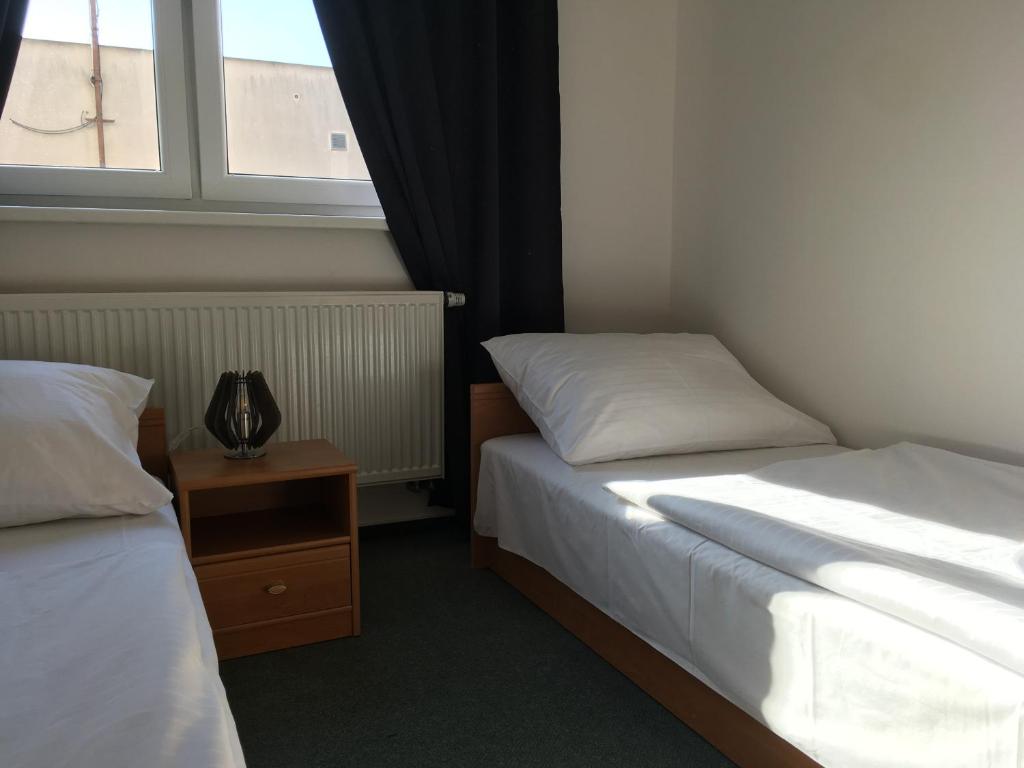 Postel nebo postele na pokoji v ubytování Hotel Arko