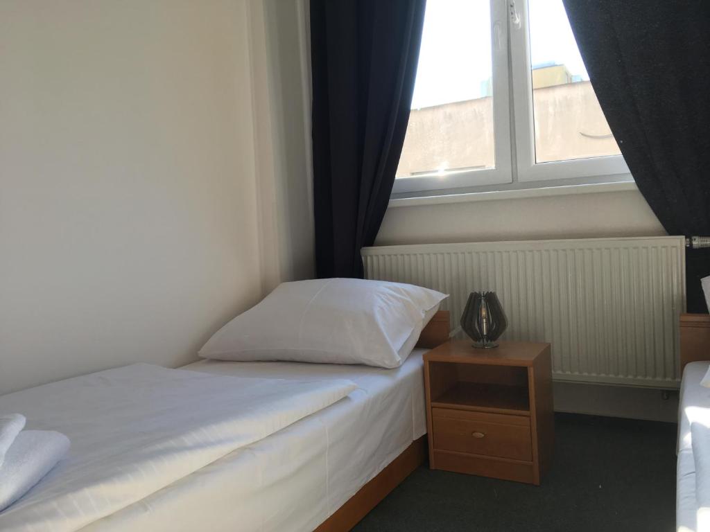 Postel nebo postele na pokoji v ubytování Hotel Arko