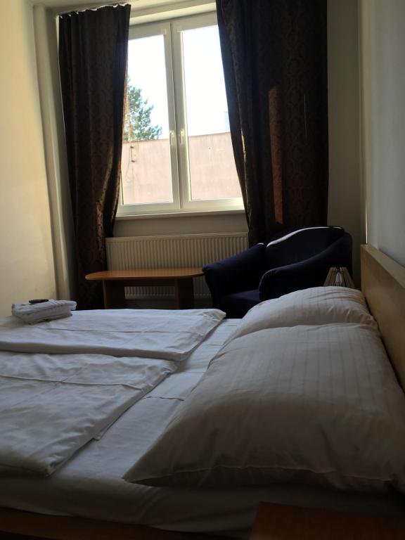 Postel nebo postele na pokoji v ubytování Hotel Arko