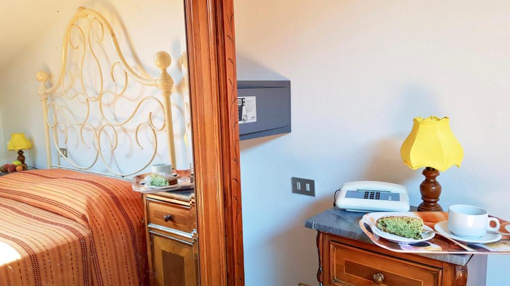 Postel nebo postele na pokoji v ubytování Albergo Natucci