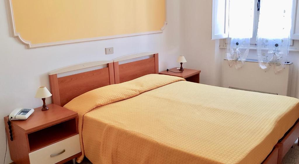 Postel nebo postele na pokoji v ubytování Albergo Natucci