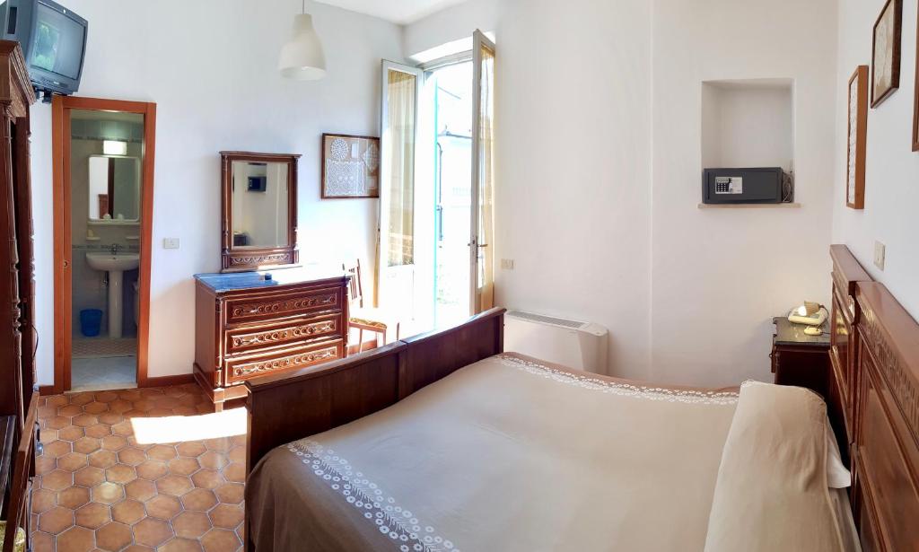 Postel nebo postele na pokoji v ubytování Albergo Natucci