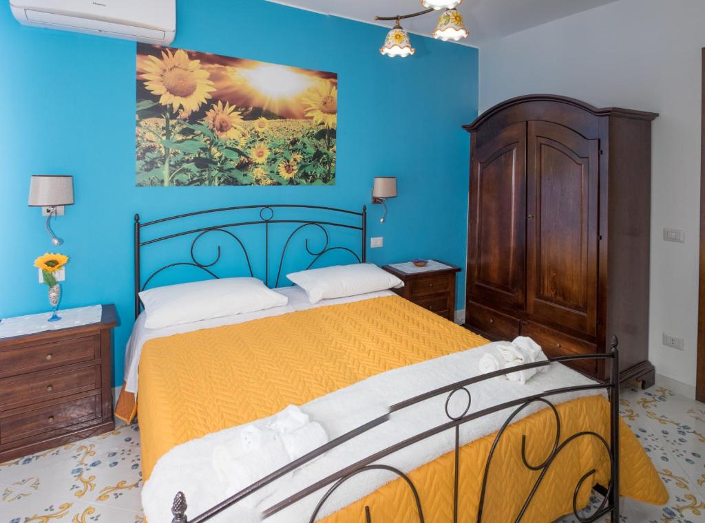 Postel nebo postele na pokoji v ubytování Vivere a colori