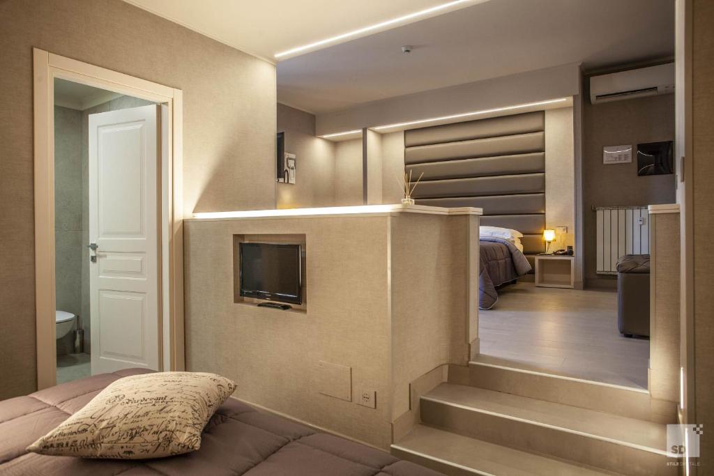 Postel nebo postele na pokoji v ubytování Hotel Cavour