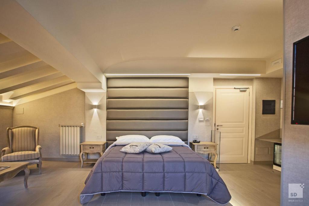 Postel nebo postele na pokoji v ubytování Hotel Cavour