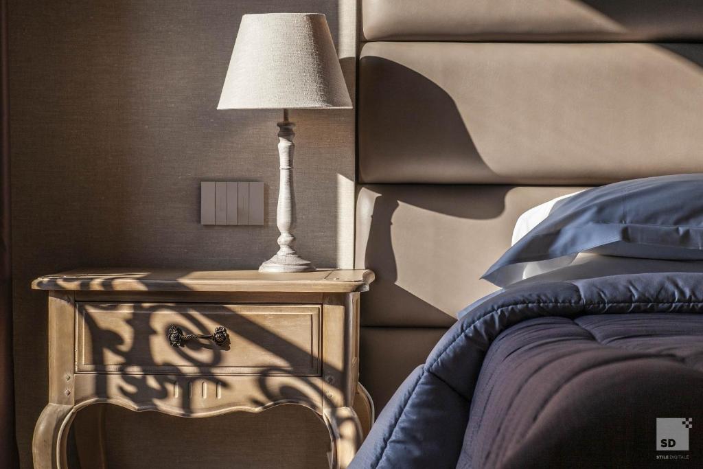 Postel nebo postele na pokoji v ubytování Hotel Cavour