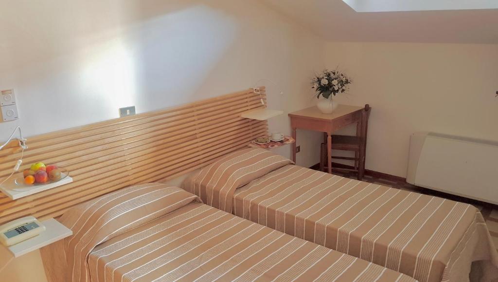 Postel nebo postele na pokoji v ubytování Albergo Natucci