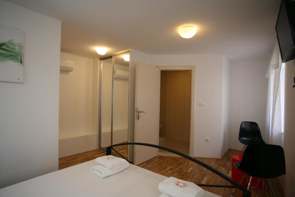 Postel nebo postele na pokoji v ubytování Rooms Beljan