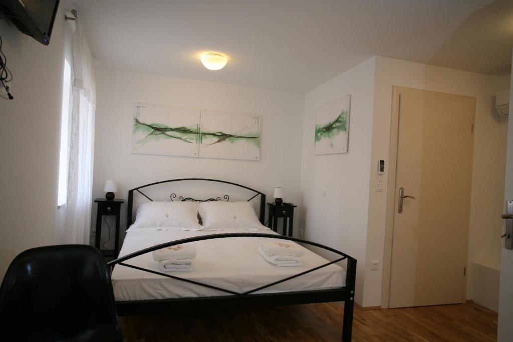 Postel nebo postele na pokoji v ubytování Rooms Beljan