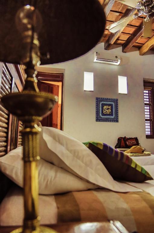Postel nebo postele na pokoji v ubytování Casa de Isabella, a Kali Hotel