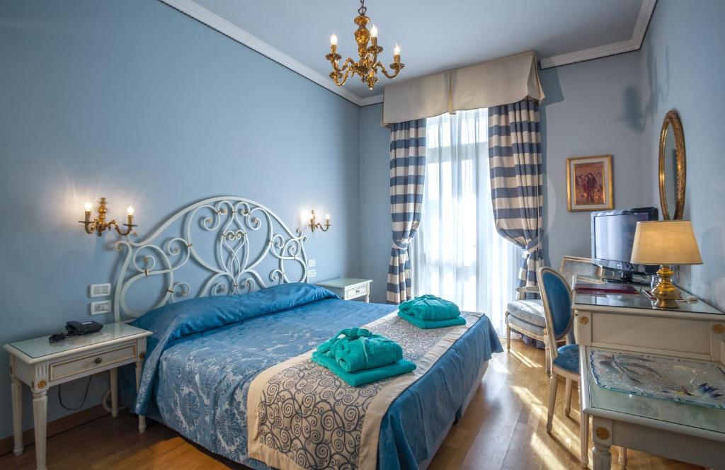 Postel nebo postele na pokoji v ubytování Hotel Quisisana Terme