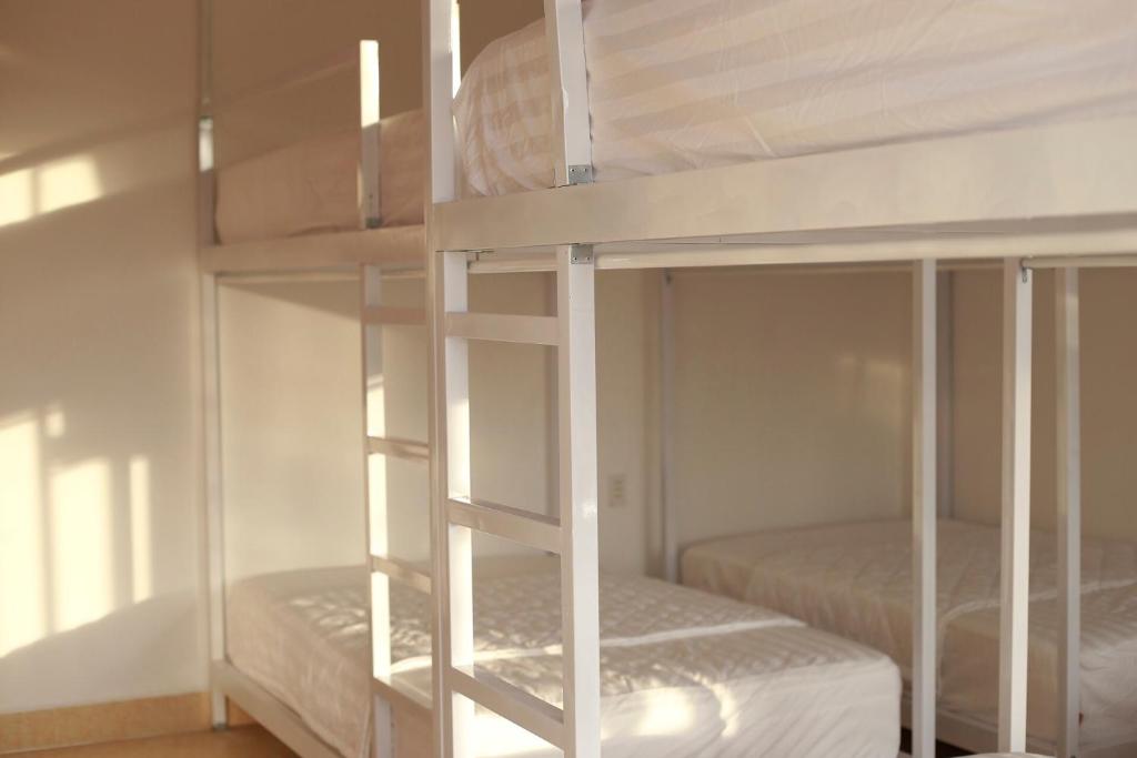 Postel nebo postele na pokoji v ubytování Purple Place Homestay Phu Quoc