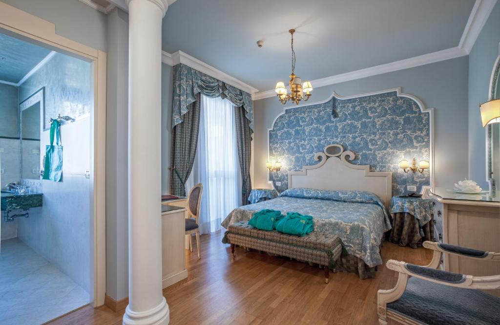 Postel nebo postele na pokoji v ubytování Hotel Quisisana Terme