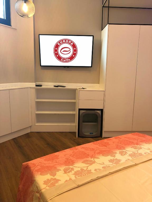 Кровать или кровати в номере Europa Apartment