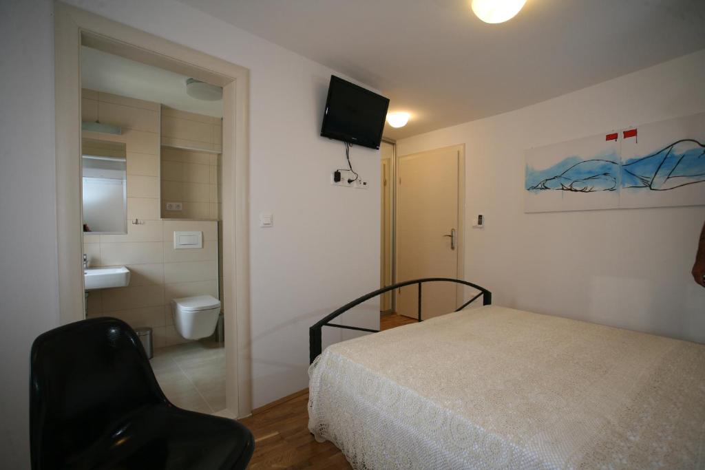 Postel nebo postele na pokoji v ubytování Rooms Beljan