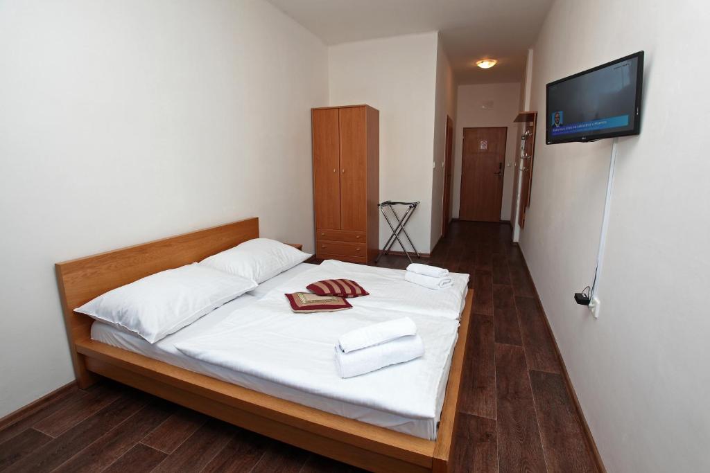 Postel nebo postele na pokoji v ubytování Hotel Arko