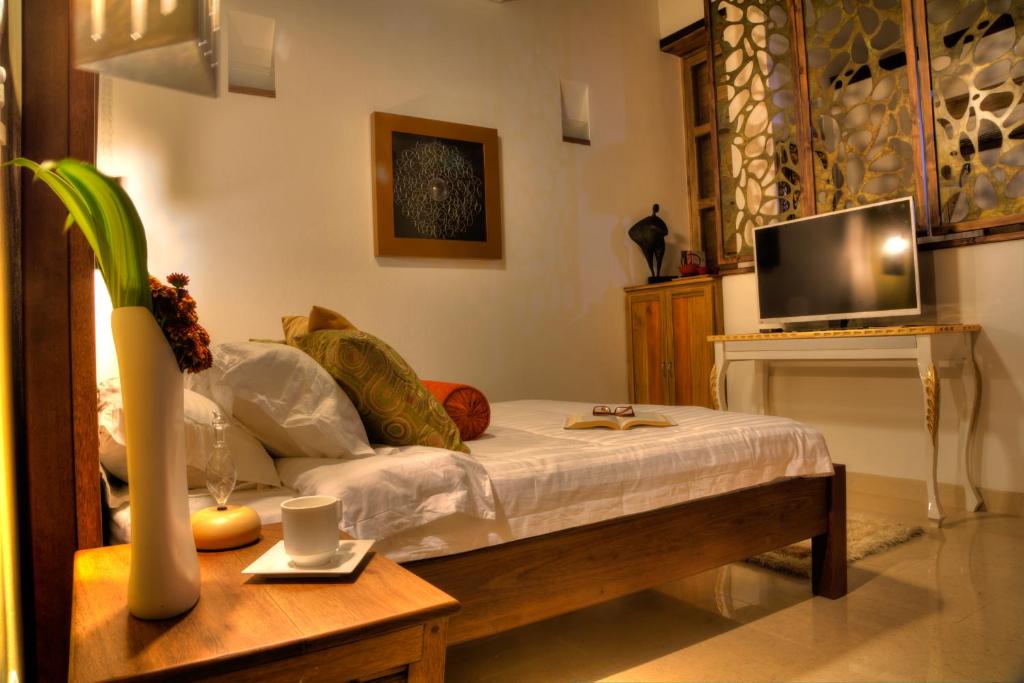 TV a/nebo společenská místnost v ubytování Casa de Leda, a Kali Hotel