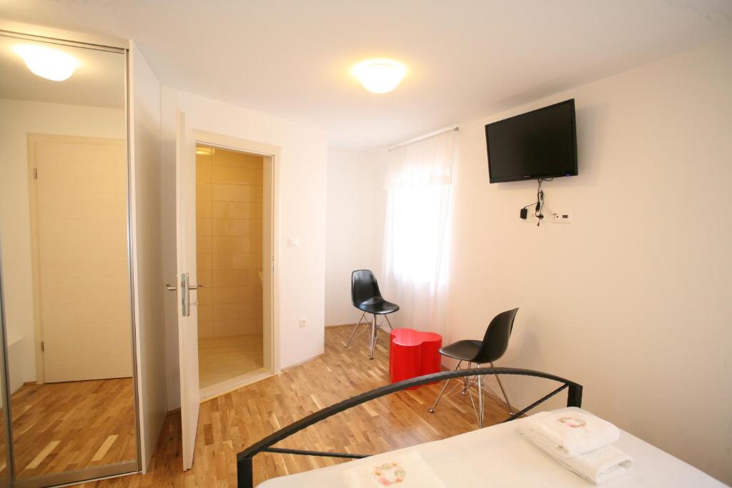 TV a/nebo společenská místnost v ubytování Rooms Beljan