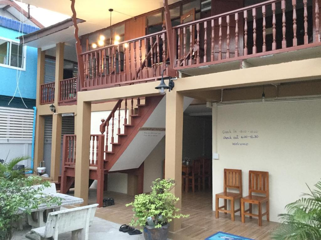 a balcony of a building with a staircase at Siriwal Guesthouse in Phra Nakhon Si Ayutthaya
