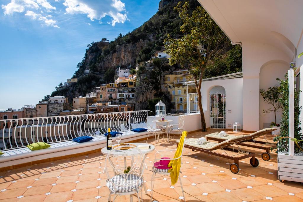 a balcony with a view of a mountain at La Gasparina in Positano