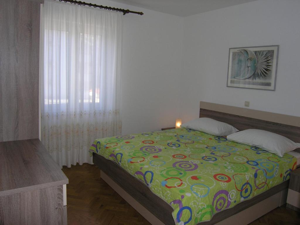 Posteľ alebo postele v izbe v ubytovaní Apartments Biljana for relaxing holidays in Baska