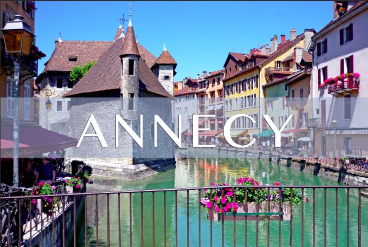 a river in a city with a sign that reads ameren at Spacious modern 2 bedroom flat great location old town + lake in Annecy