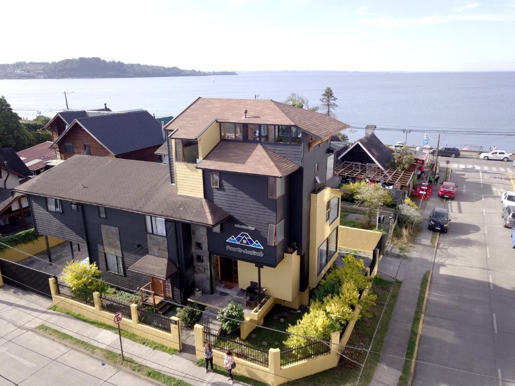 an aerial view of a house with the ocean at Puerto Austral in Puerto Varas