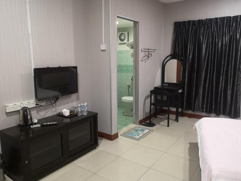 Postel nebo postele na pokoji v ubytování Home Inn Hotel
