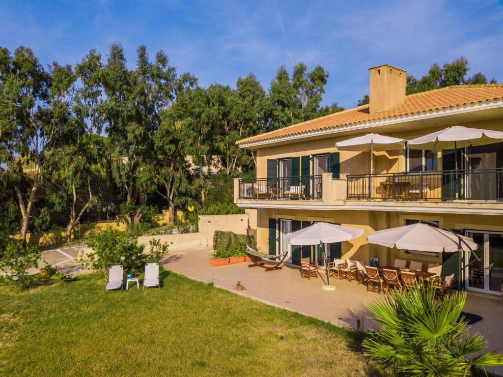 A garden outside Kounopetra Beach Luxury Villas
