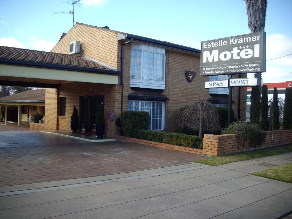 a building with a motel sign in front of it at Estelle Kramer Motel in Armidale