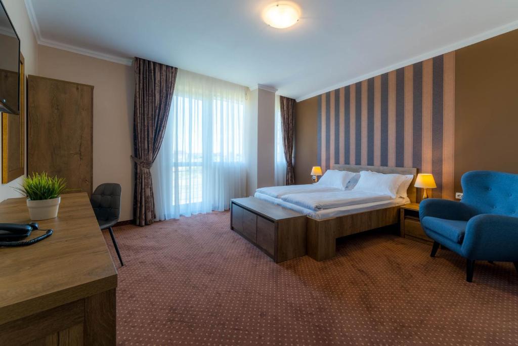 Postel nebo postele na pokoji v ubytování Sky Hotel