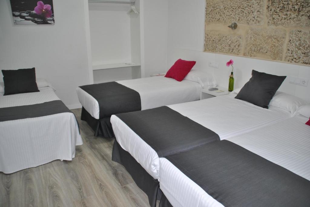 Postel nebo postele na pokoji v ubytování Hotel Junquera