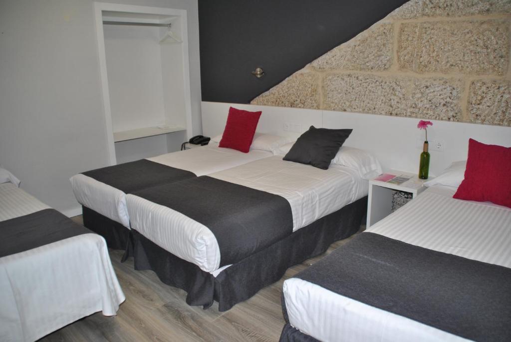 Postel nebo postele na pokoji v ubytování Hotel Junquera