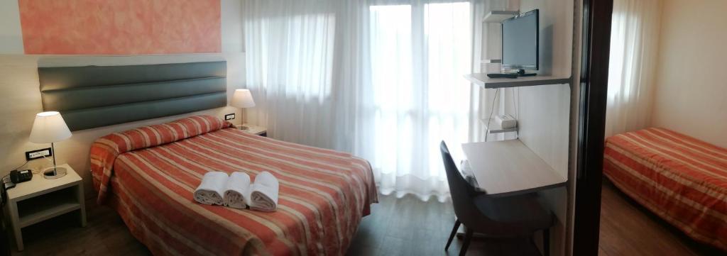 Postel nebo postele na pokoji v ubytování Hotel Kristall