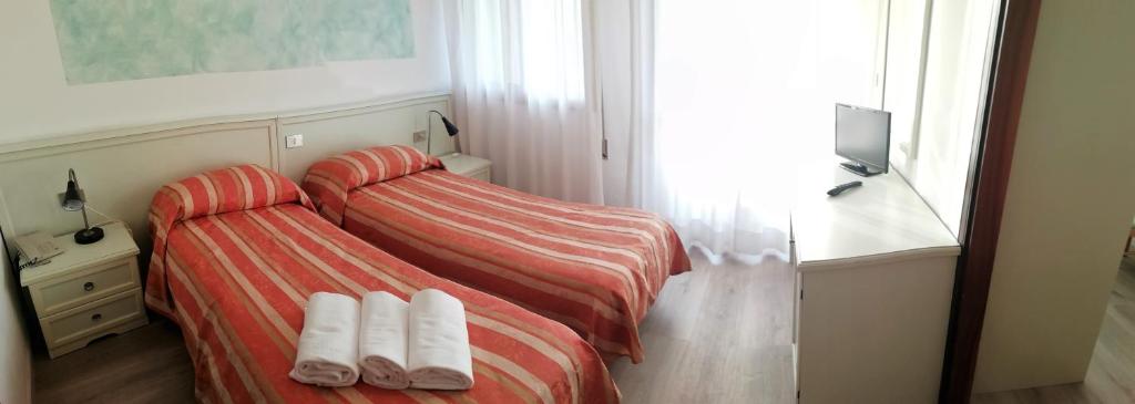 Postel nebo postele na pokoji v ubytování Hotel Kristall