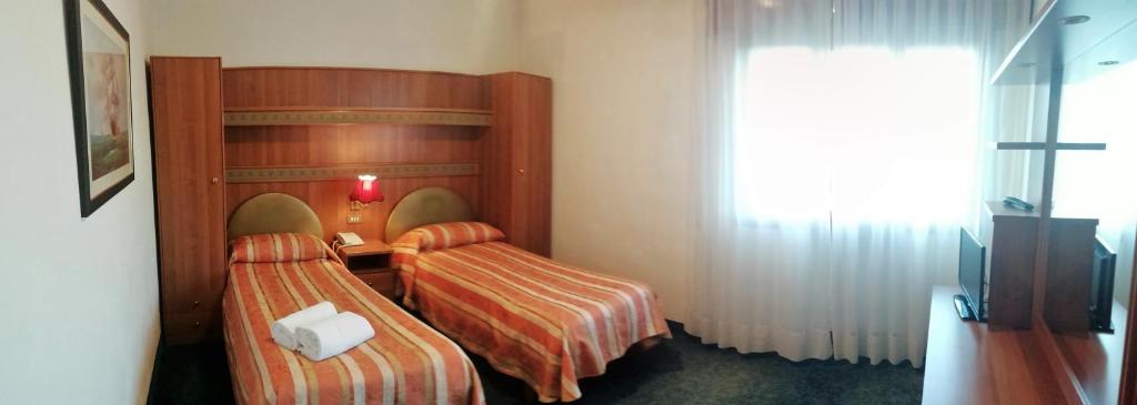 Postel nebo postele na pokoji v ubytování Hotel Kristall