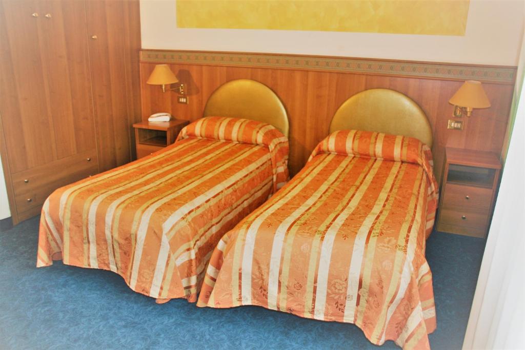 Postel nebo postele na pokoji v ubytování Hotel Kristall