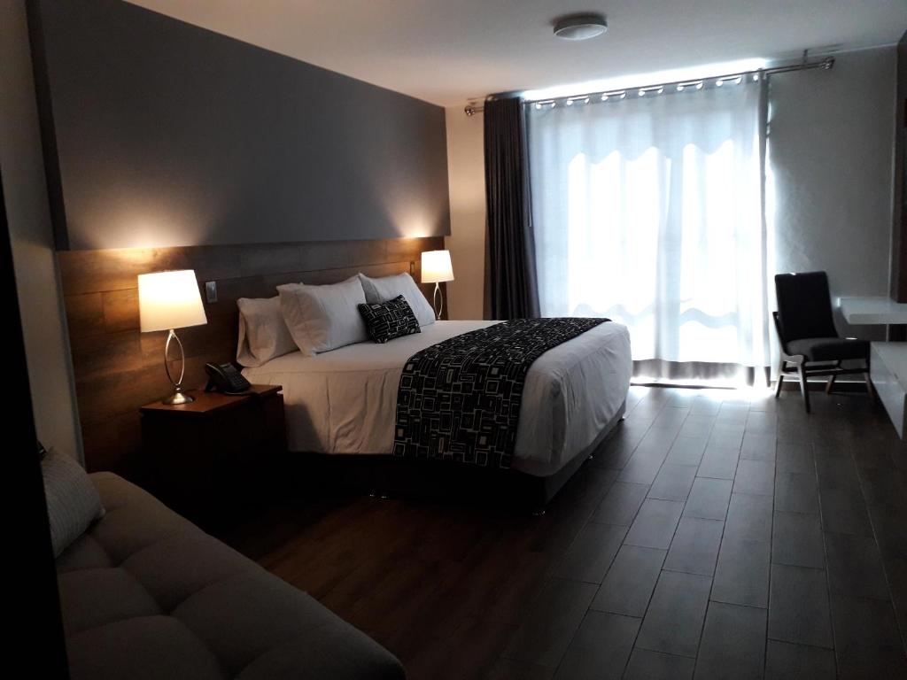 Postel nebo postele na pokoji v ubytování Hotel Corral Grande