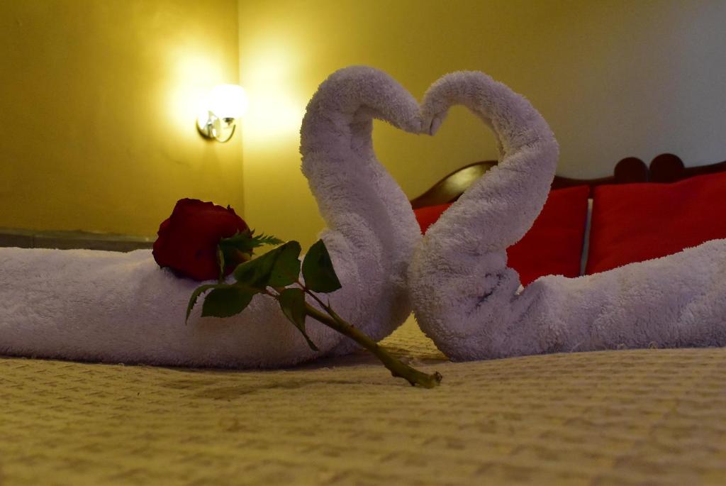 Ένα ή περισσότερα κρεβάτια σε δωμάτιο στο Kuska Hostal