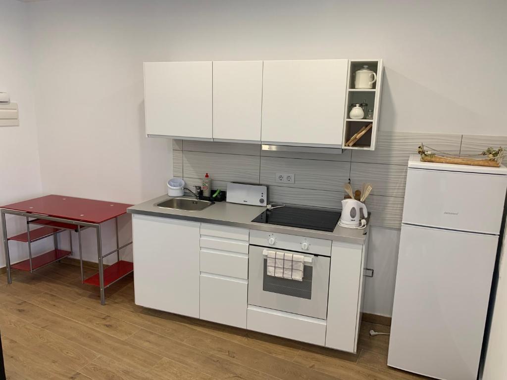 A kitchen or kitchenette at Paseo Marítimo, Los Cristianos Over the sea FREE WIFI