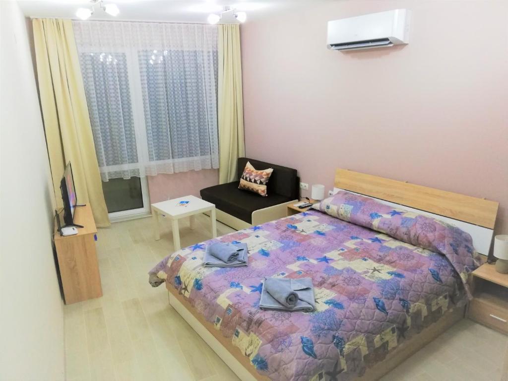 A bed or beds in a room at Studio flat for upto 3 people