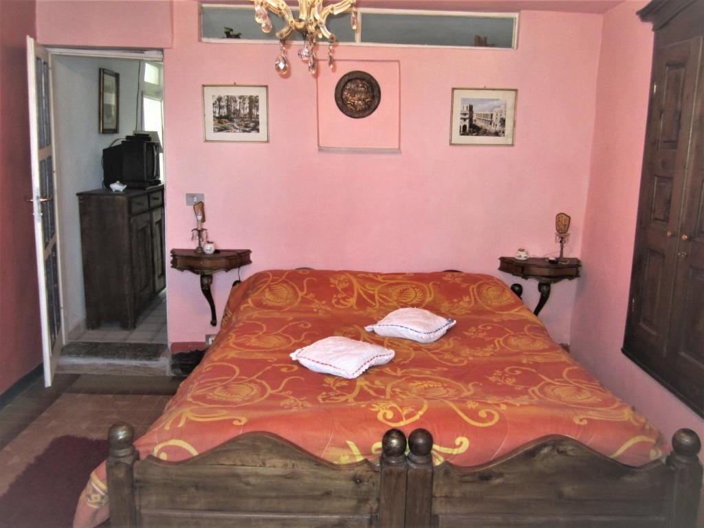 Łóżko lub łóżka w pokoju w obiekcie B&B I Colori dell'Arcobaleno