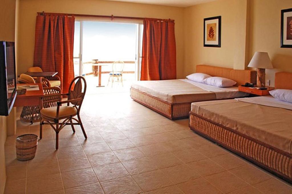Postel nebo postele na pokoji v ubytování Almont Beach Resort