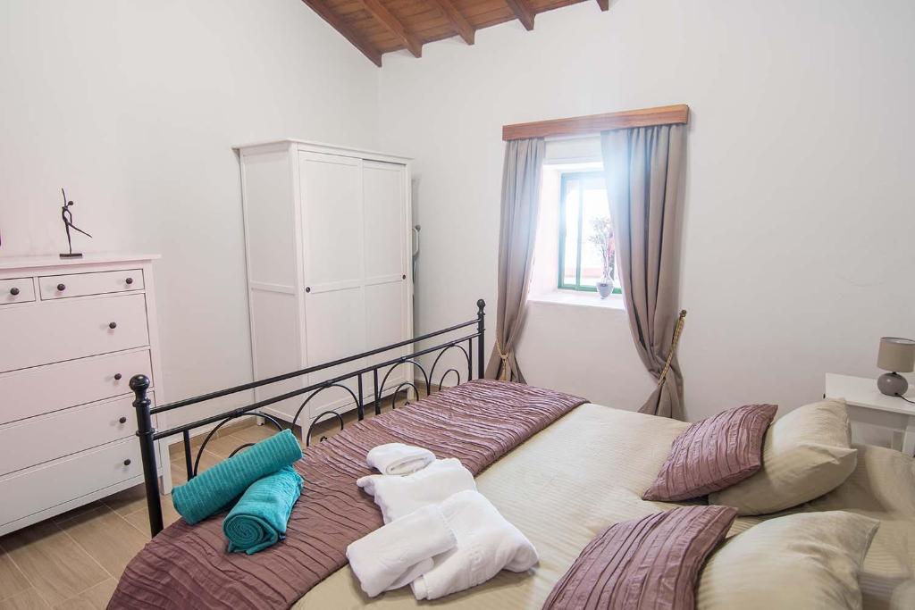 Posteľ alebo postele v izbe v ubytovaní Casa Terpsicore